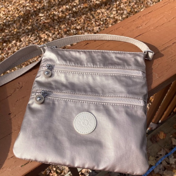 Kipling Handbags - Kipling silver crossbody purse